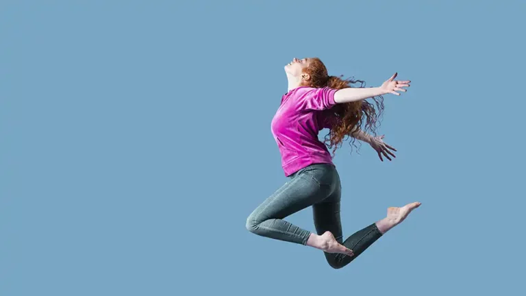 Girl jumping in the air just like flying in dream