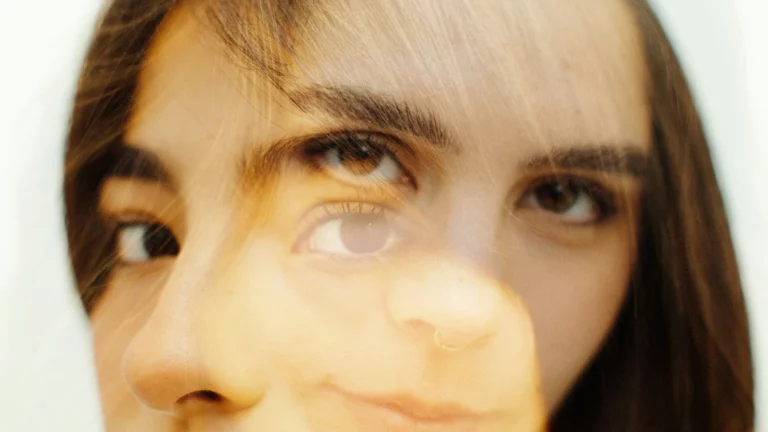 Double-exposure portrait suggesting two perspectives