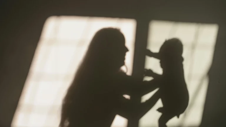 Shadow of a mother holding a child